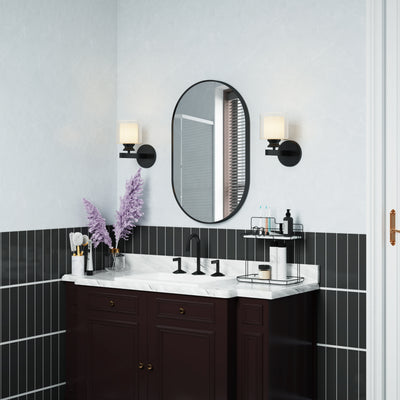 20 in. W x 32 in. H Oval Framed Wall Mount Bathroom Vanity Mirror in Matte Black